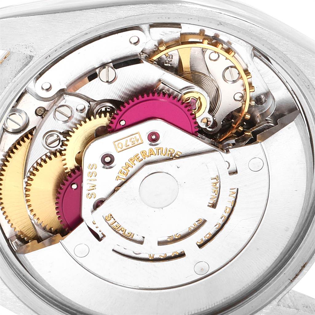 The image shows a close-up of the internal mechanical movement of a Rolex Vintage Collection 1505 Men's Steel and Gold (two tone) Silver Dial 1505 Men's Steel and Gold (two tone) Silver Dial watch.