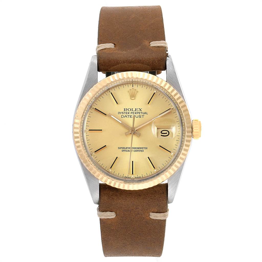 The image shows a frontal view of a Rolex Vintage Collection 16013 Men's Stainless Steel Champagne Dial 16013 Men's Stainless Steel Champagne Dial model, showcasing the dial, bezel, and leather strap.