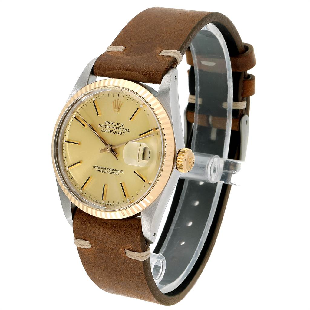 This Rolex Vintage Collection 16013 Men's Stainless Steel Champagne Dial 16013 Men's Stainless Steel Champagne Dial Oyster Perpetual Datejust is shown at a slight angle, highlighting the dial, bezel, crown, and leather strap.