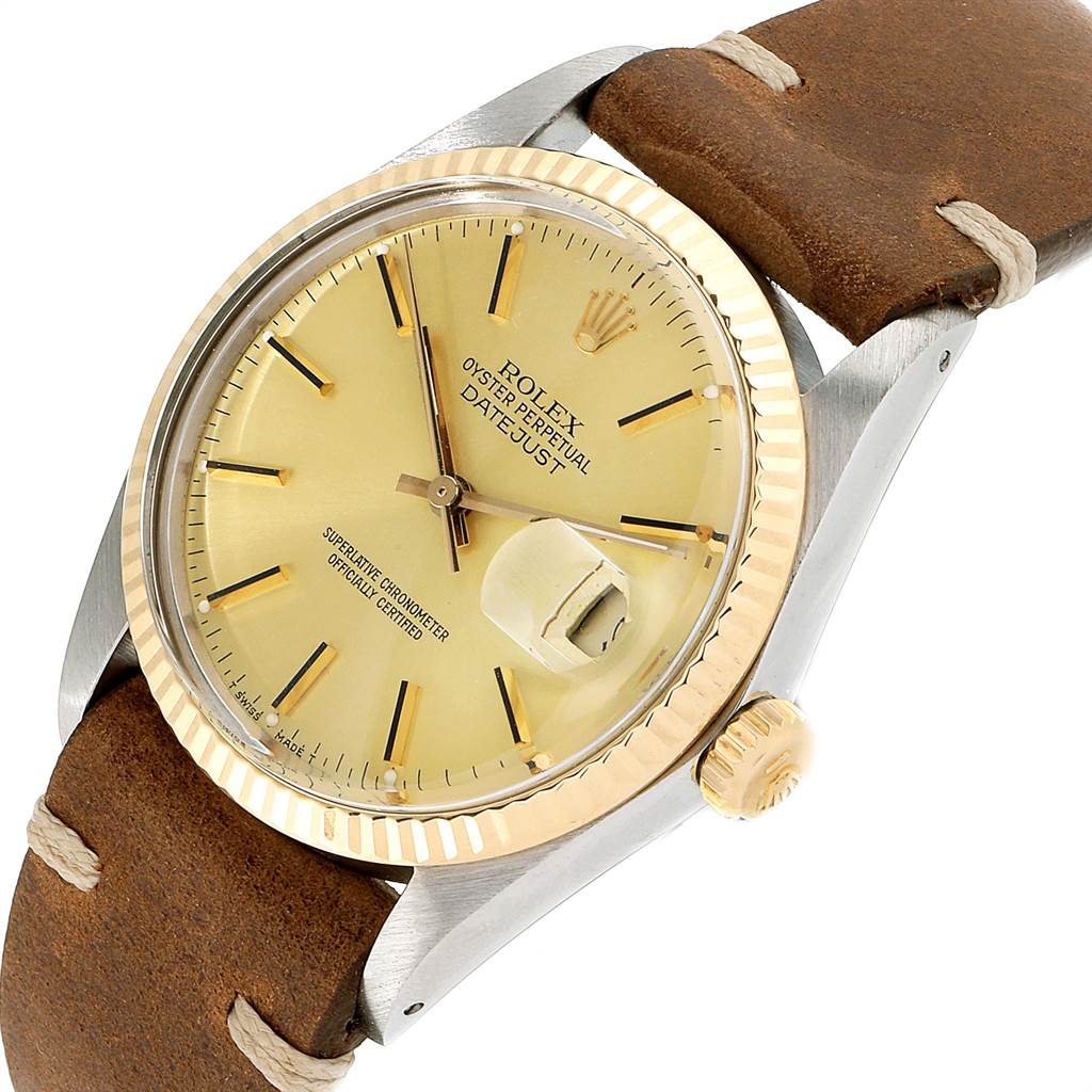 The Rolex Vintage Collection 16013 Men's Stainless Steel Champagne Dial 16013 Men's Stainless Steel Champagne Dial model is shown at a slight angle, displaying its gold bezel, brown leather strap, and date window.
