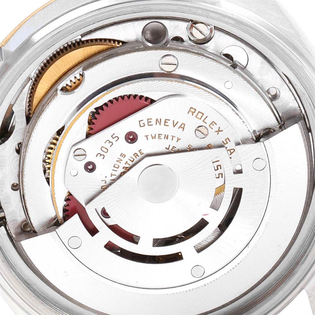 This close-up image shows the inner mechanics and movement parts of the Vintage Collection Rolex watch.