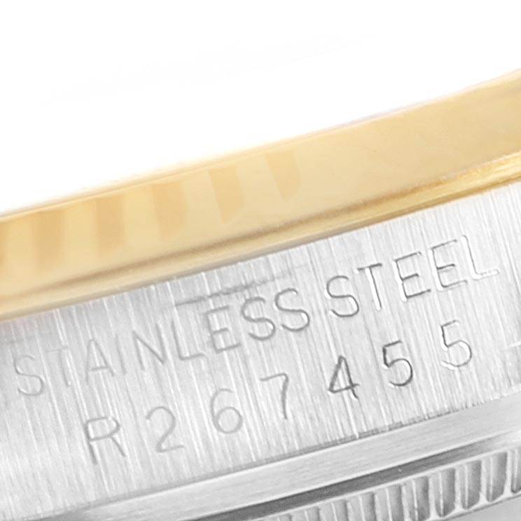 The image shows a close-up angle of the case side of the Vintage Collection Rolex, highlighting the "Stainless Steel" engraving.