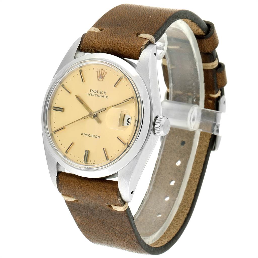 The Rolex Vintage Collection 6694 Men's Stainless Steel Champagne Dial 6694 Men's Stainless Steel Champagne Dial watch is shown at an angled view, displaying the face, crown, and brown leather strap.