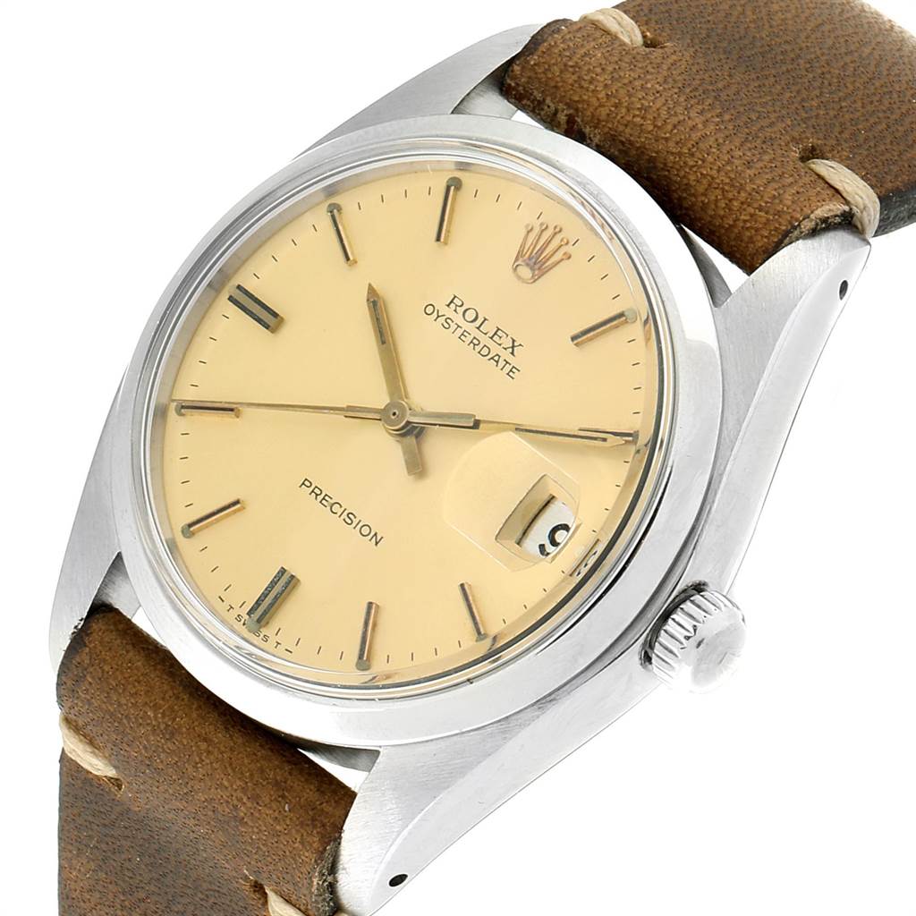 The Rolex Vintage Collection 6694 Men's Stainless Steel Champagne Dial 6694 Men's Stainless Steel Champagne Dial model is shown from a tilted top-down angle, highlighting the dial, case, crown, and leather strap.