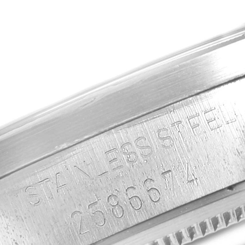 This image shows a close-up view of the engraved stainless steel case side of a Vintage Collection model by Rolex.