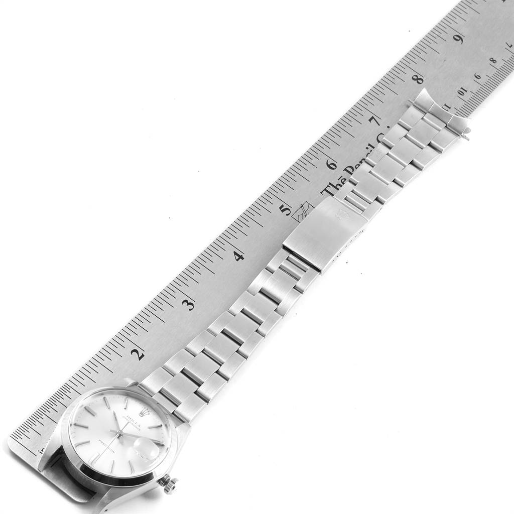 The image shows a Rolex Vintage Collection 6694 Men's Stainless Steel Silver Dial 6694 Men's Stainless Steel Silver Dial watch laid flat with a measuring ruler.