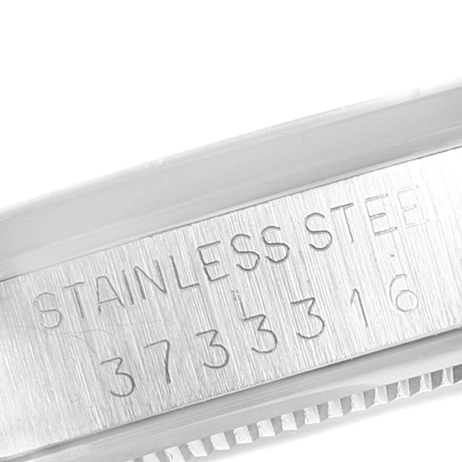 This angle shows the side of the Rolex Vintage Collection 6694 Men's Stainless Steel Silver Dial 6694 Men's Stainless Steel Silver Dial watch with its serial number and stainless steel engraving.