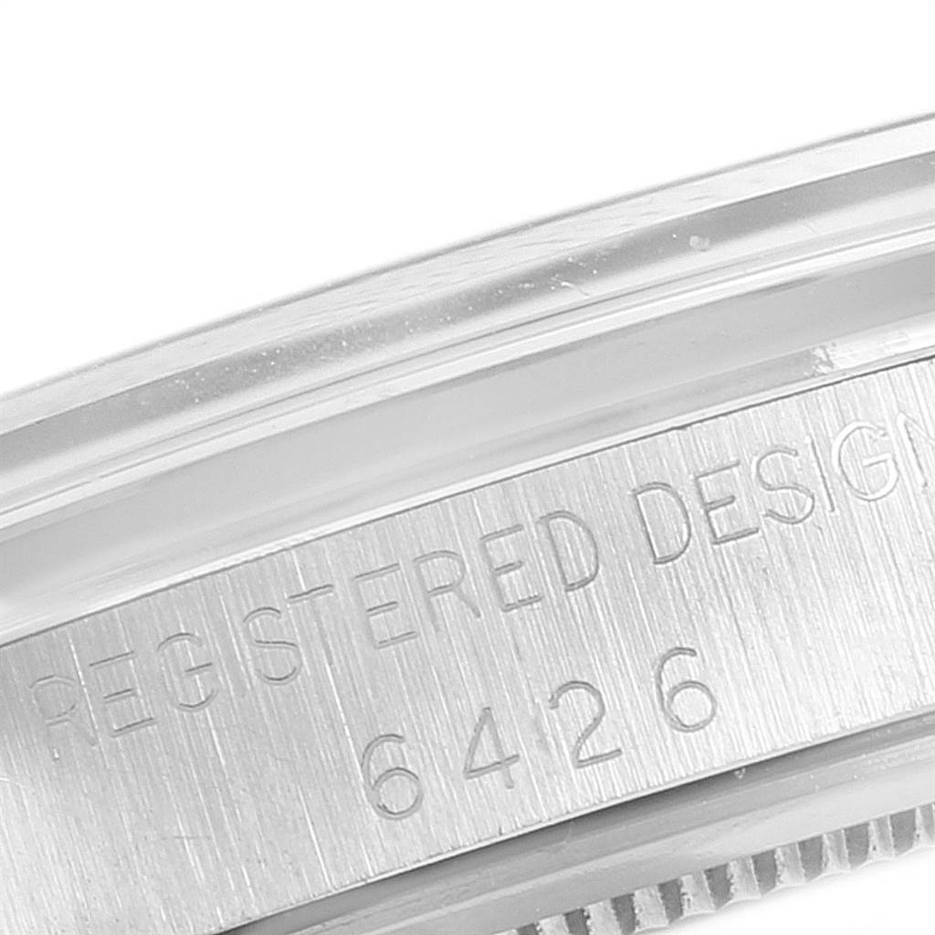 This image shows a close-up of the case edge with engraved text on a Vintage Collection model by Rolex.