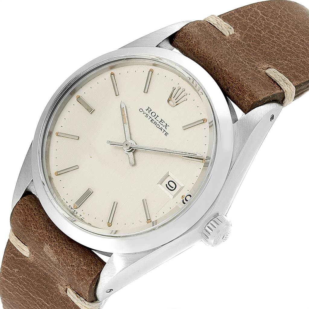 This Vintage Collection Rolex watch is shown from an angled front view, featuring the dial, crown, and brown leather strap.