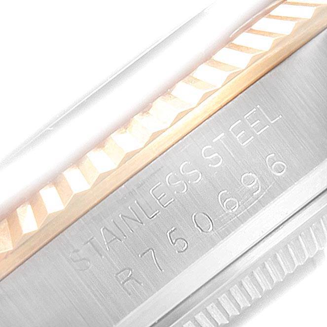 This image shows a close-up of the bezel and case of the Rolex Vintage Collection 16013 Men's Stainless Steel Champagne Dial 16013 Men's Stainless Steel Champagne Dial model, highlighting the stainless steel engraving and model number.