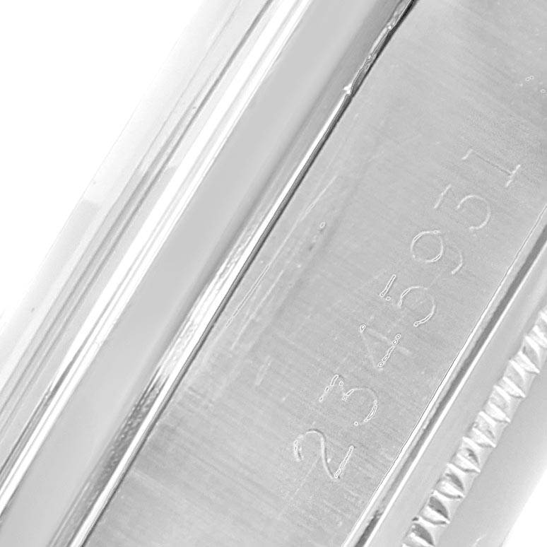 This close-up image of the Rolex Vintage Collection 1500 Men's Stainless Steel Silver Dial 1500 Men's Stainless Steel Silver Dial model shows the watch’s engraved serial number on the side of the case.