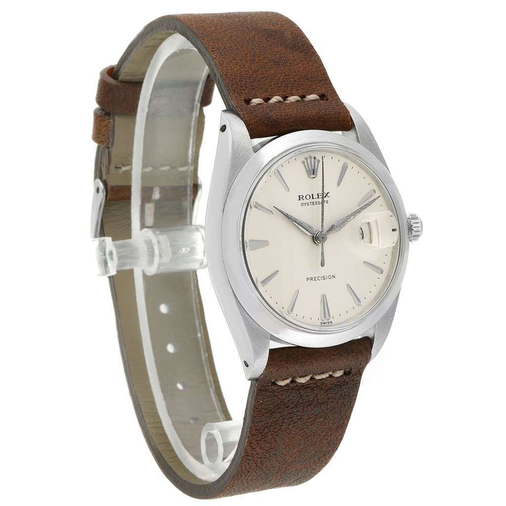 This image shows a side angle view of a Rolex Vintage Collection 6694 Men's Stainless Steel Silver Dial 6694 Men's Stainless Steel Silver Dial watch, displaying its dial, case, crown, and leather strap.