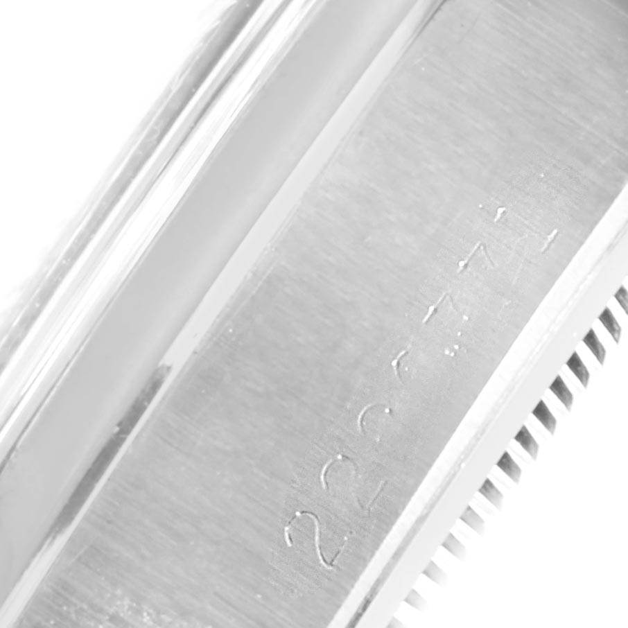 The image shows an angled close-up of the case side and part of the bezel of a Rolex Vintage Collection 6694 Men's Stainless Steel Silver Dial 6694 Men's Stainless Steel Silver Dial model.