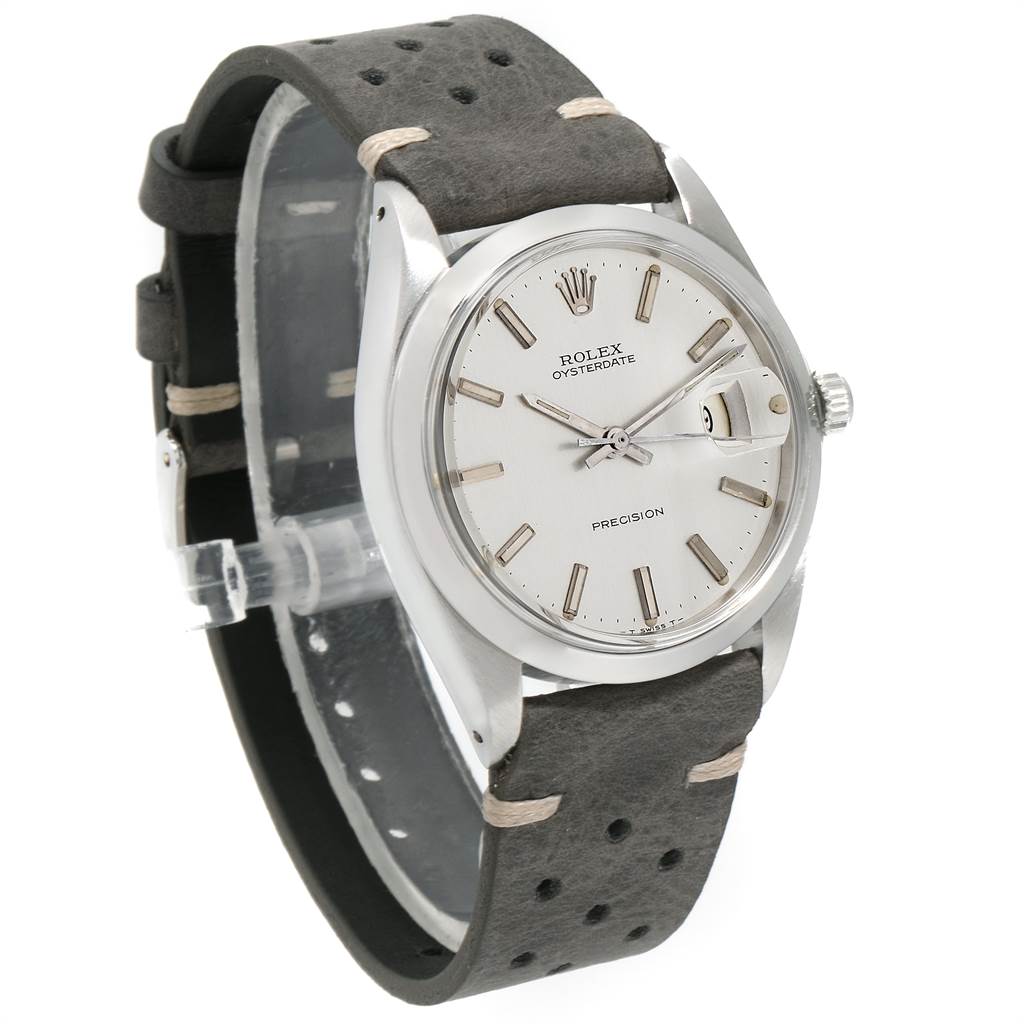 This Vintage Collection Rolex watch is shown at a slight angle, highlighting its face, casing, and leather strap.