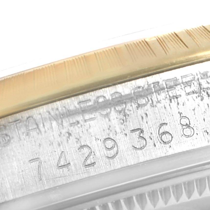 This close-up image shows the engraved serial number on the side of the case of a Vintage Collection model by Rolex.