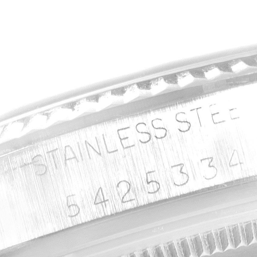 This close-up image shows the side with engravings of a Rolex Vintage Collection 16014 Men's Stainless Steel Silver Dial 16014 Men's Stainless Steel Silver Dial watch case in stainless steel.