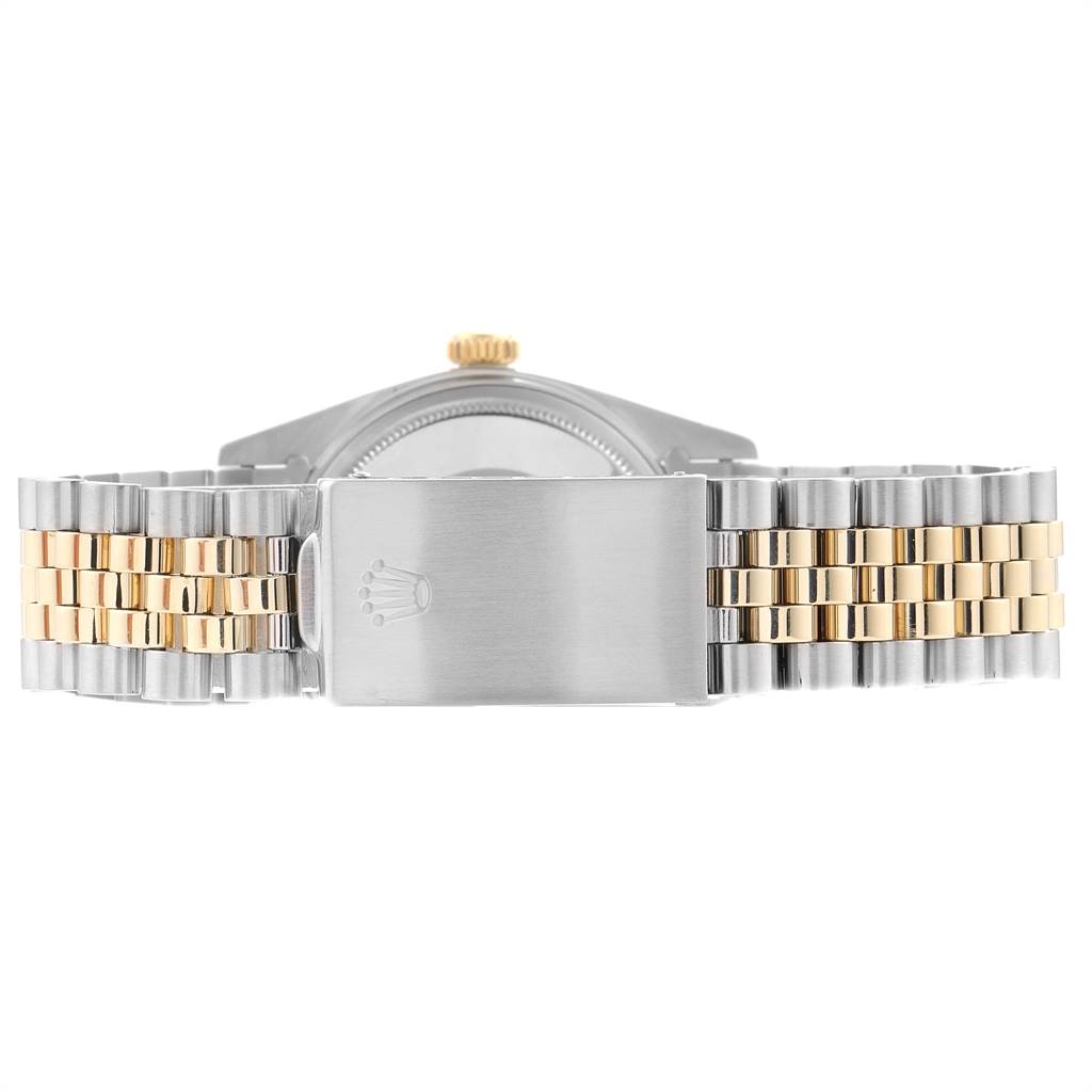 The image shows the clasp and bracelet of the Rolex Vintage Collection 1601 Men
s Steel and Gold (two tone) Champagne Dial 1601 Men
s Steel and Gold (two tone) Champagne Dial watch from the back.