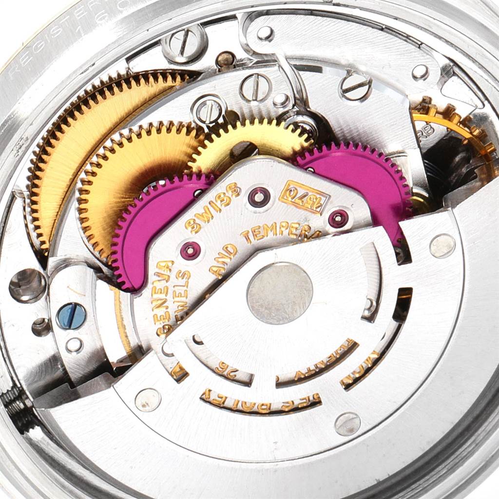 The image shows a close-up view of the intricate internal mechanism of a Rolex Vintage Collection 1601 Men
s Steel and Gold (two tone) Champagne Dial 1601 Men
s Steel and Gold (two tone) Champagne Dial watch.