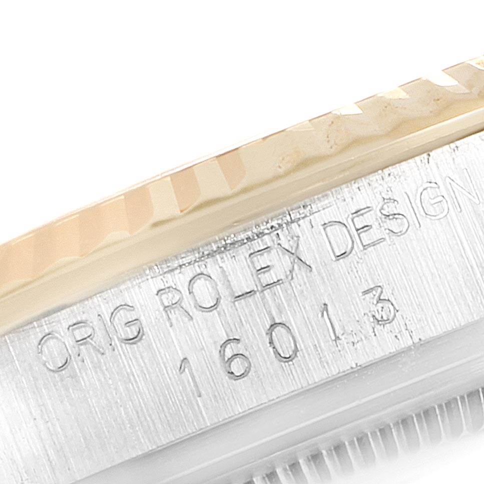 This close-up shows the side of the bezel and case of the Vintage Collection model by Rolex, featuring engraving.