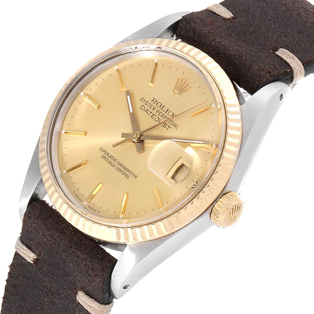 The Vintage Collection Rolex watch is shown at an angled view, displaying the dial, bezel, crown, and part of the strap.
