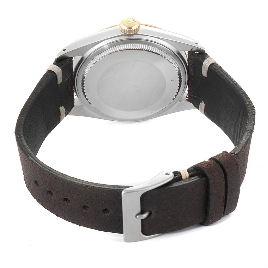 This image shows the back case and leather strap of a Rolex Vintage Collection 16013 Men's Stainless Steel Champagne Dial 16013 Men's Stainless Steel Champagne Dial model watch from a rear angle.