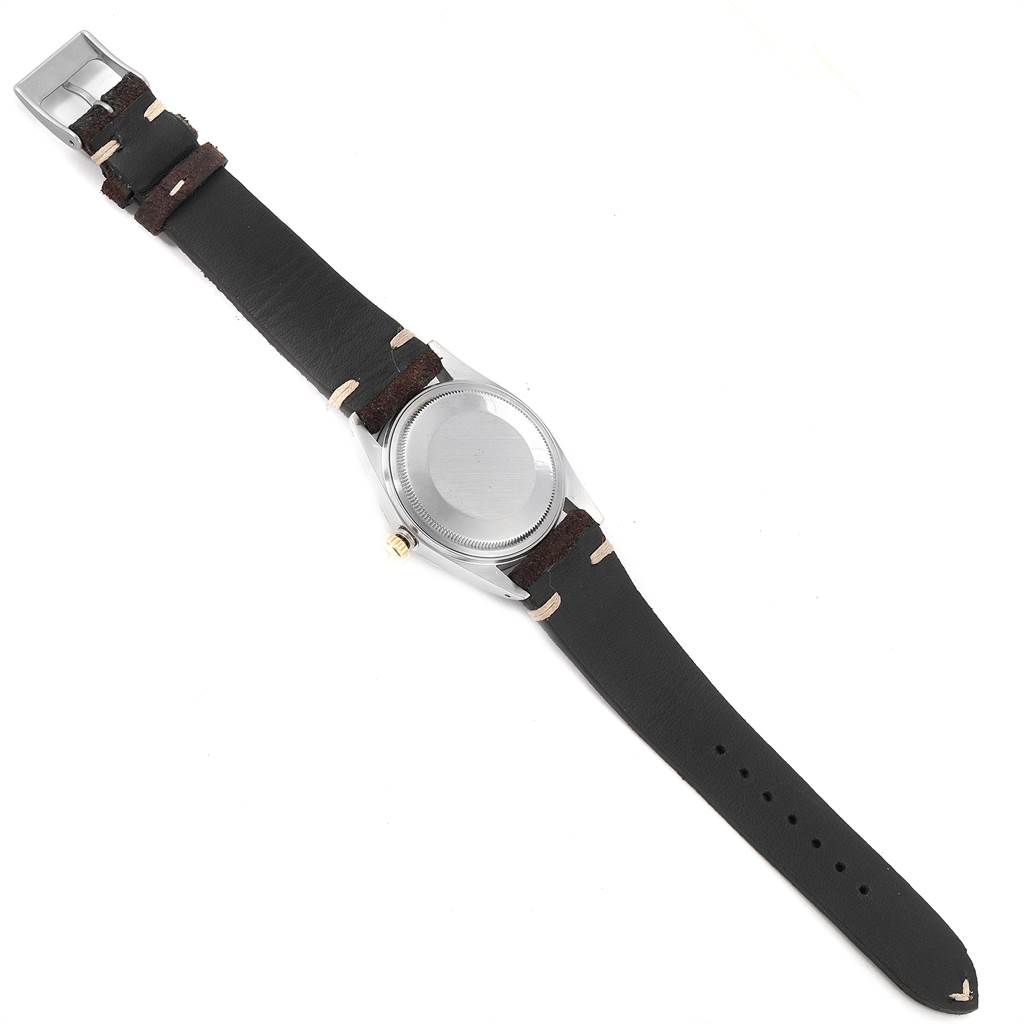 The image shows the back and strap of a Rolex Vintage Collection 16013 Men's Stainless Steel Champagne Dial 16013 Men's Stainless Steel Champagne Dial watch, with a focus on the case back and leather strap.