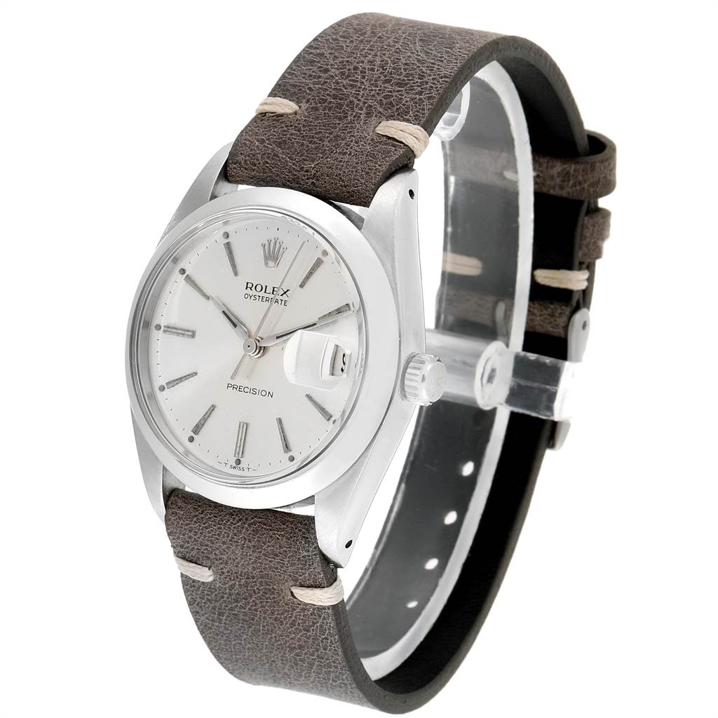The Rolex Vintage Collection 6694 Men's Stainless Steel Silver Dial 6694 Men's Stainless Steel Silver Dial watch is shown at a slight angle, displaying its face, bezel, crown, and leather strap.