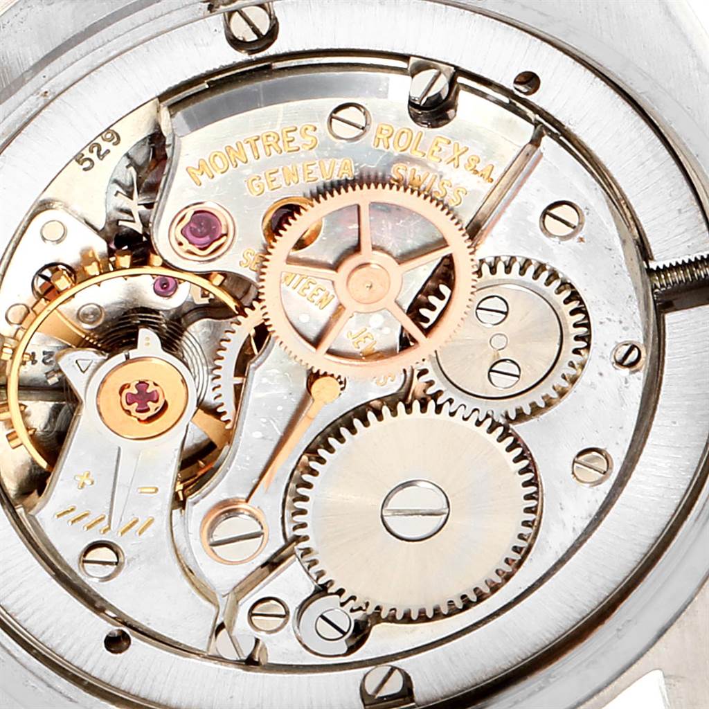 The image shows a close-up view of the movement mechanism in a Vintage Collection Rolex watch.