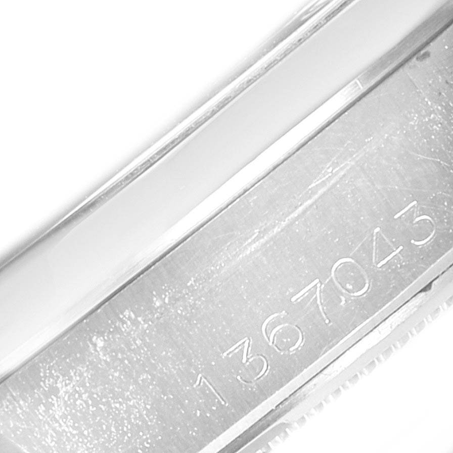 The image shows a close-up of the serial number on the inner bezel of a Rolex Vintage Collection 6694 Men's Stainless Steel Silver Dial 6694 Men's Stainless Steel Silver Dial watch.