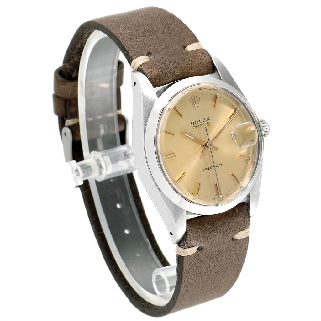 The image shows a Rolex Vintage Collection 6694 Men's Stainless Steel Champagne Dial 6694 Men's Stainless Steel Champagne Dial watch at a side angle, highlighting its beige face, metallic case, and brown leather strap.