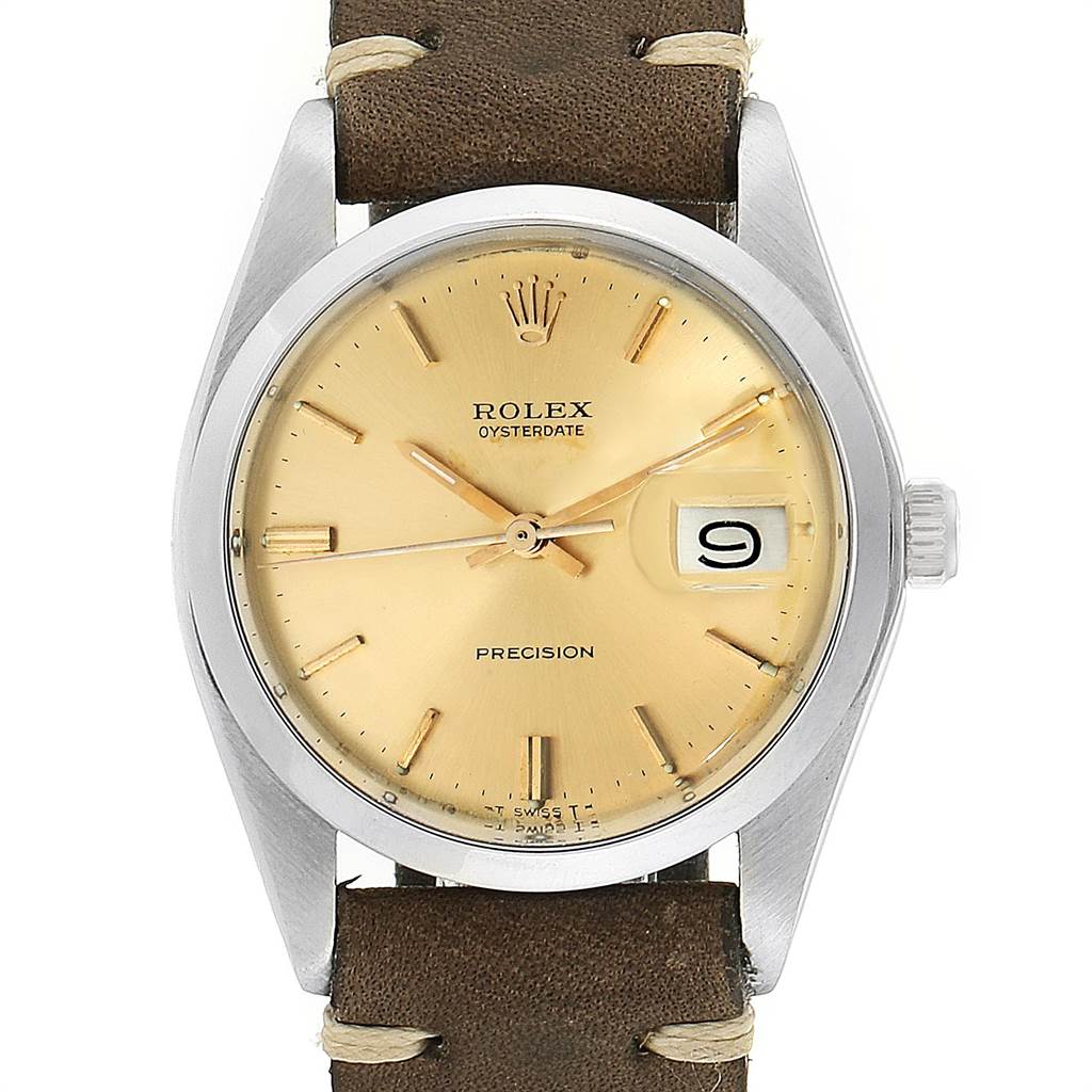 This is a front view of the Rolex Vintage Collection 6694 Men's Stainless Steel Champagne Dial 6694 Men's Stainless Steel Champagne Dial Oysterdate watch featuring a brown leather strap and a gold dial.