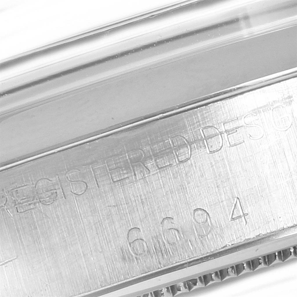 The image shows a close-up of the engraved side detailing on the Vintage Collection model by Rolex.