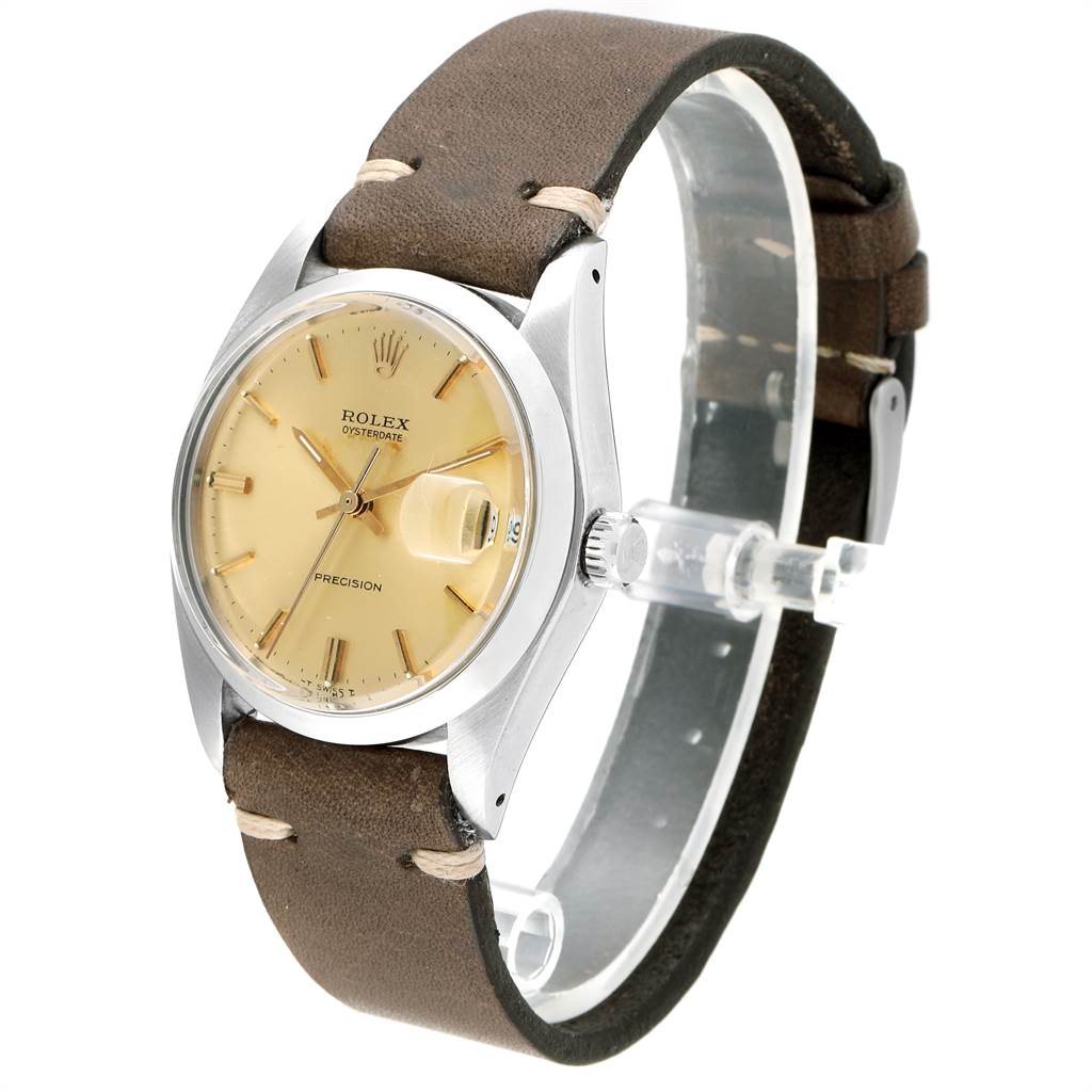 The Rolex Vintage Collection 6694 Men's Stainless Steel Champagne Dial 6694 Men's Stainless Steel Champagne Dial watch is shown from a three-quarter angle, displaying the face, dial, crown, and leather strap.