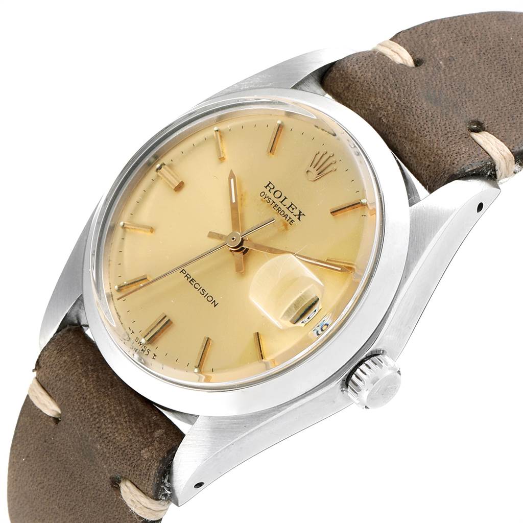 This image shows a Rolex Vintage Collection 6694 Men's Stainless Steel Champagne Dial 6694 Men's Stainless Steel Champagne Dial watch at a three-quarter angle, highlighting the dial, crown, and leather strap.