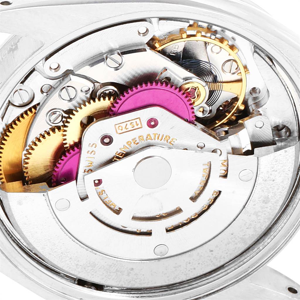 This image shows a close-up view of the internal mechanical components of a Rolex Vintage Collection 1500 Men's Stainless Steel Silver Dial 1500 Men's Stainless Steel Silver Dial model watch.