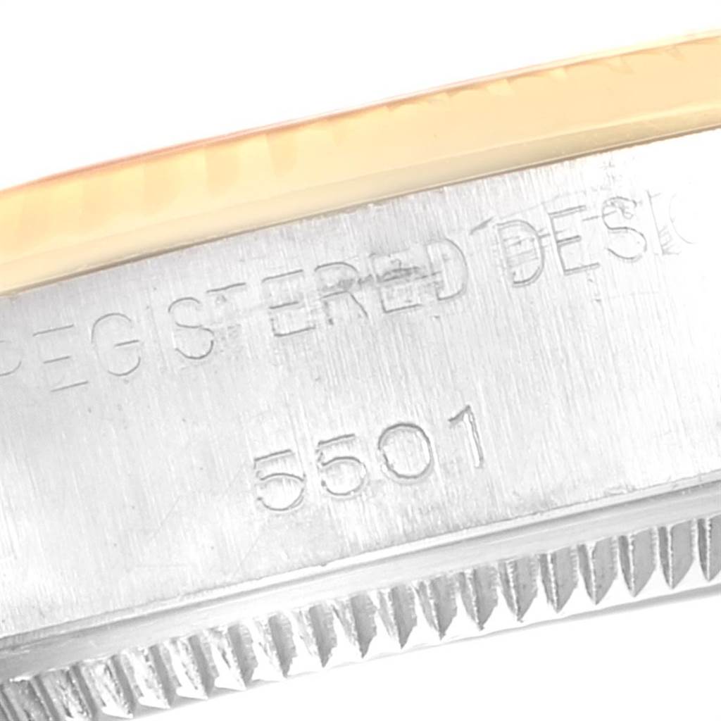 The image shows a close-up of the edge of the casing with serial number 5501 for the Vintage Collection watch model by Rolex.