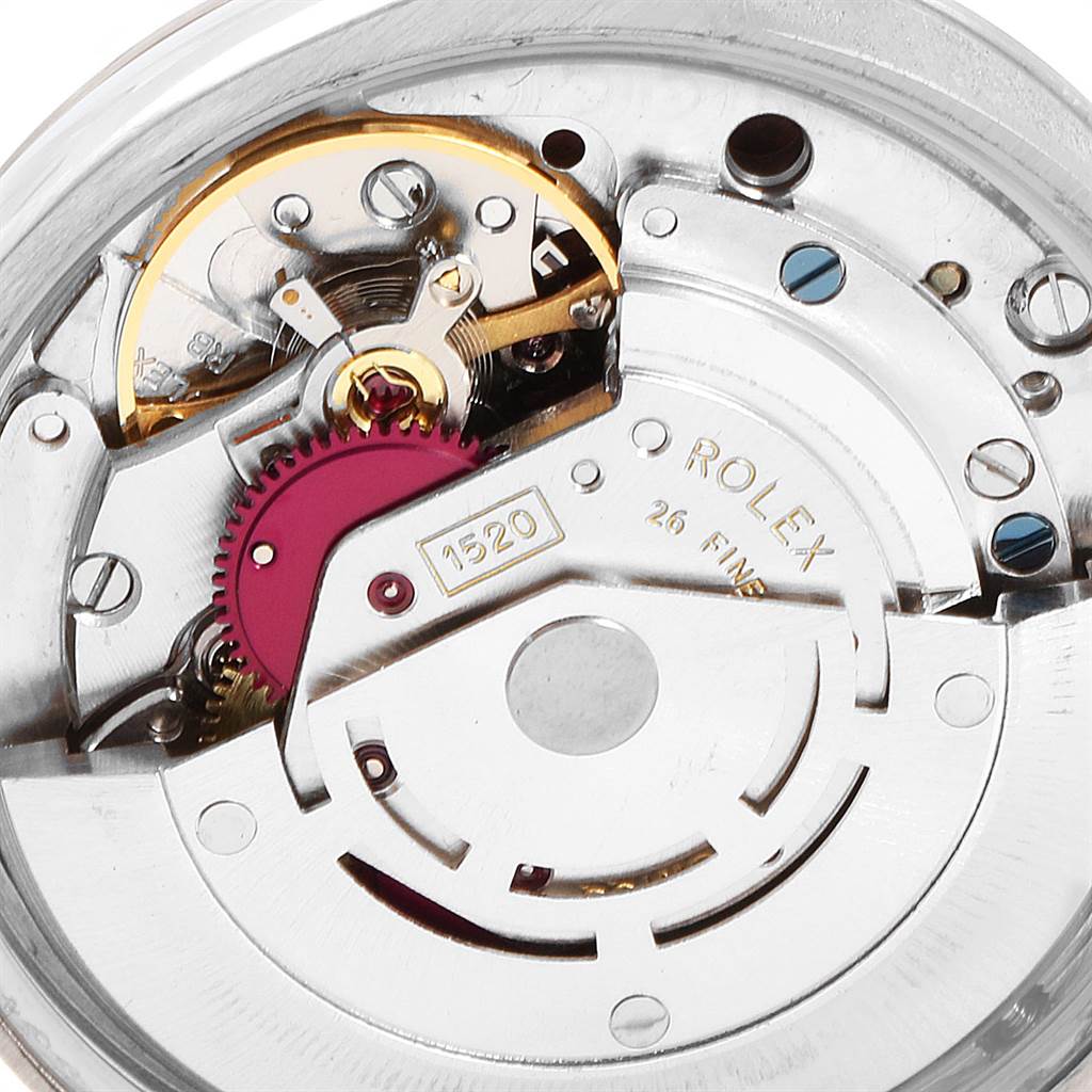 The image shows a close-up of the inner mechanical movement of the Vintage Collection model by Rolex.