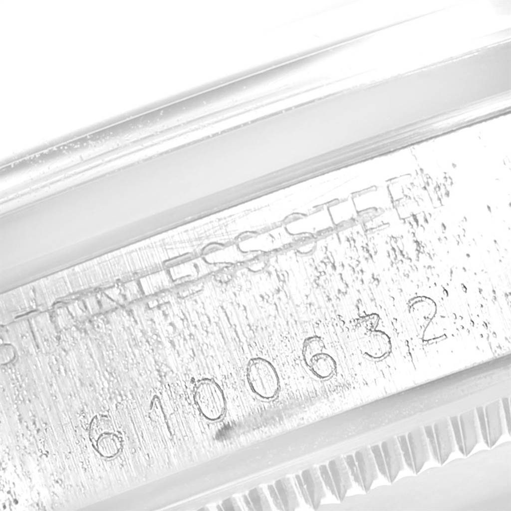 This is a close-up image of the serial number and stainless steel marking on a Vintage Collection model by Rolex.