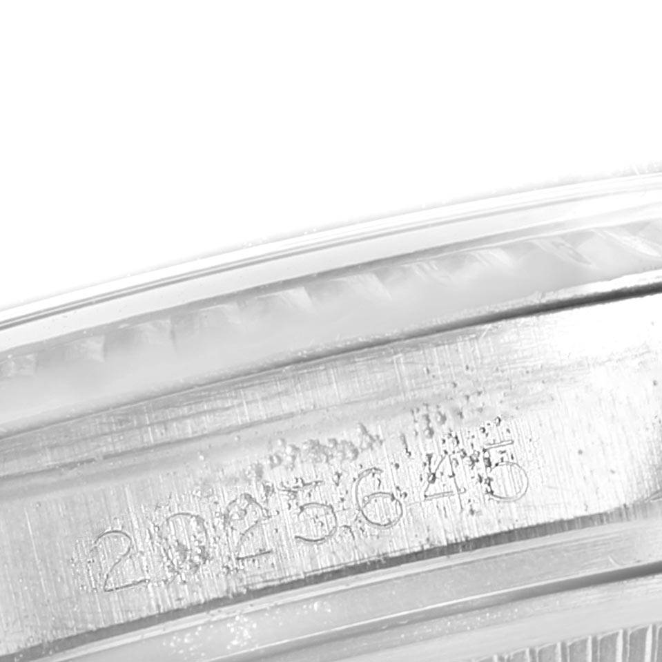 This image shows the serial number engraving on the side of the bezel of a Rolex Vintage Collection 1601 Men's Stainless Steel Grey Dial 1601 Men's Stainless Steel Grey Dial model watch.