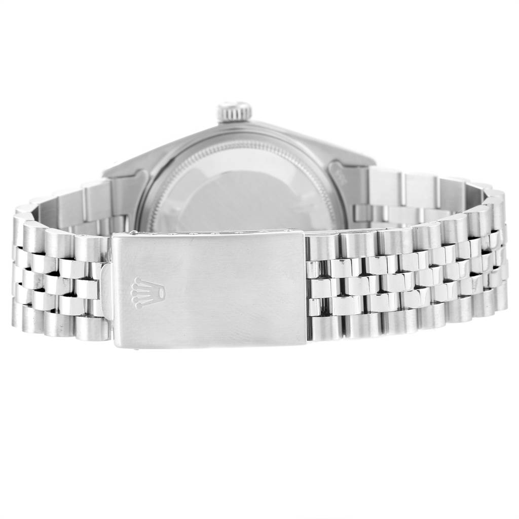 The image shows the back of the Rolex Vintage Collection 1601 Men's Stainless Steel Grey Dial 1601 Men's Stainless Steel Grey Dial watch, including its case, crown, and metal bracelet with clasp.