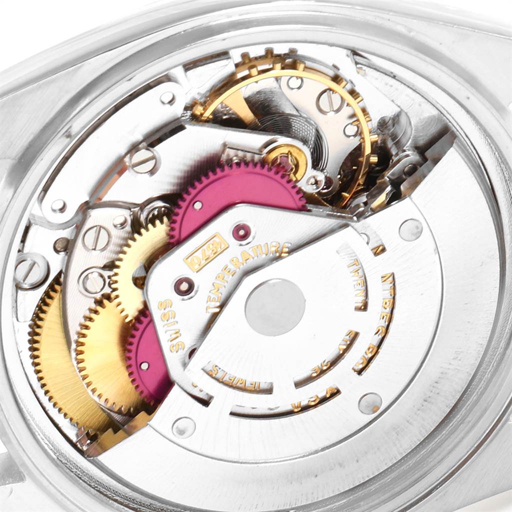 The image shows the internal mechanism of a Rolex Vintage Collection 1601 Men's Stainless Steel Green Dial 1601 Men's Stainless Steel Green Dial watch, captured from the back with a focus on its gears.