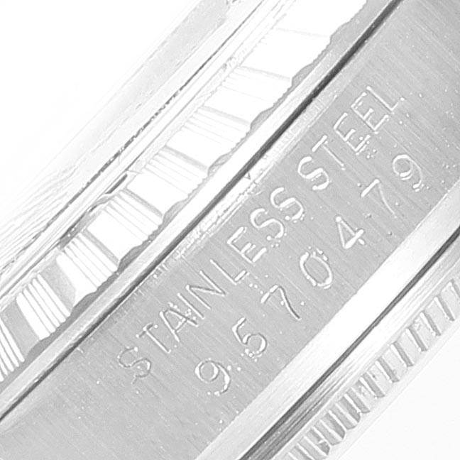 This is a close-up shot of the engraved serial number and "Stainless Steel" markings on the case side of a Rolex Vintage Collection 16030 Men's Stainless Steel Silver Dial 16030 Men's Stainless Steel Silver Dial watch.