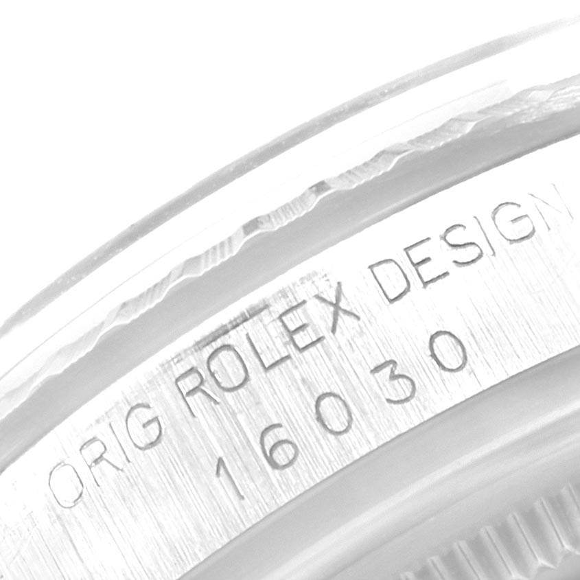 This image shows a close-up of the serial engraving on the case of a Vintage Collection Rolex model 16030.