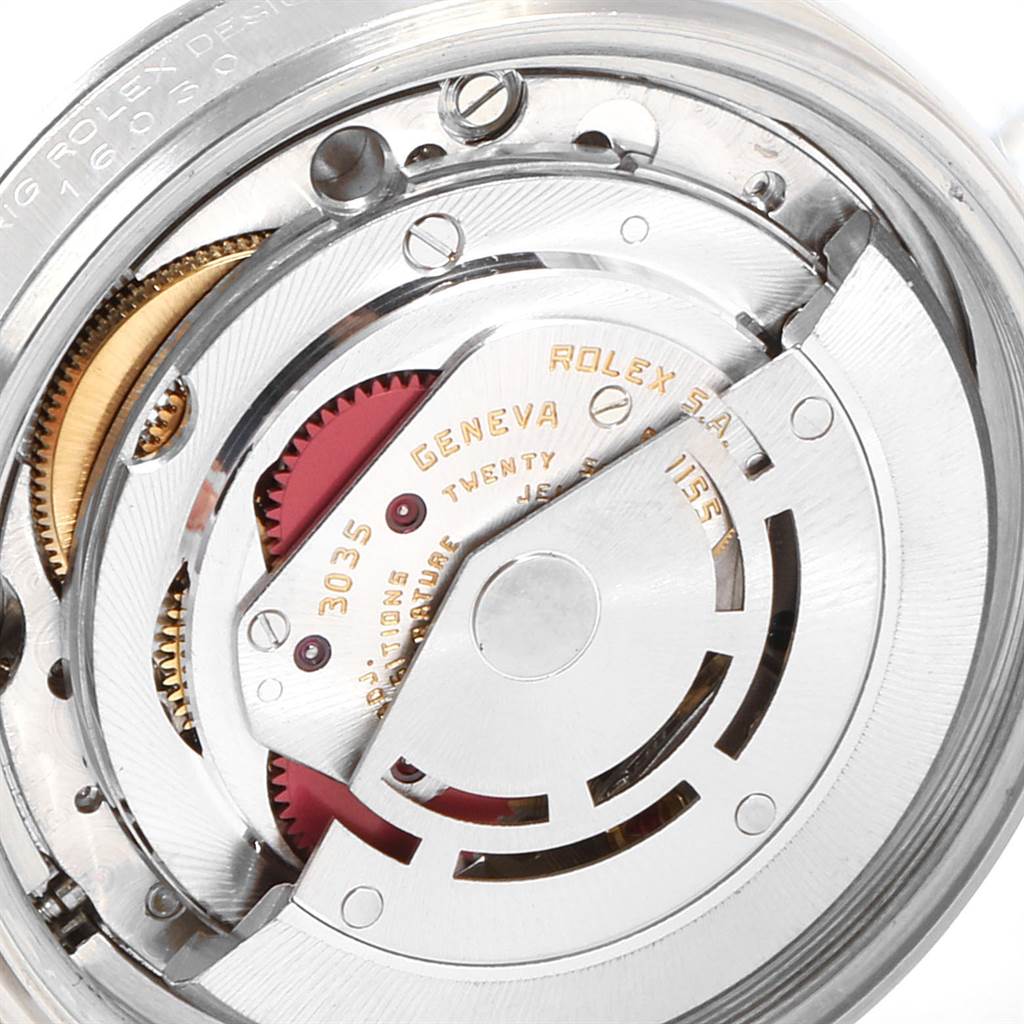 The image shows the internal mechanism of a Vintage Collection Rolex watch, highlighting gears and the rotor.