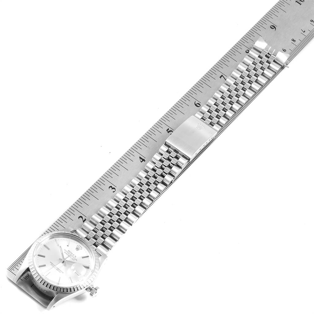 The Rolex Vintage Collection 16030 Men's Stainless Steel Silver Dial 16030 Men's Stainless Steel Silver Dial model watch is shown from a top-down angle, displaying the face, bracelet, and a ruler for measurement.