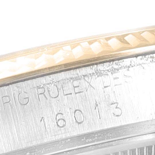 This image shows a close-up of the side engraving and bezel of the Rolex Vintage Collection 16013 Men's Stainless Steel Champagne Dial 16013 Men's Stainless Steel Champagne Dial model 16013.