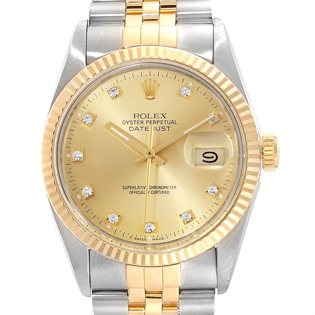 The image shows a front view of the Rolex Vintage Collection 16013 Men's Stainless Steel Champagne Dial 16013 Men's Stainless Steel Champagne Dial Oyster Perpetual Datejust watch with a gold and silver bracelet.