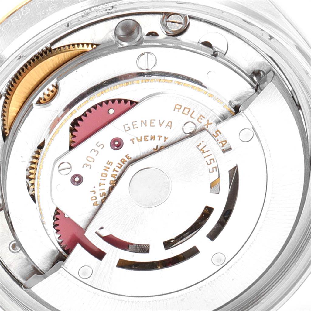 The image shows an angled close-up of the movement inside a Rolex Vintage Collection 16013 Men's Stainless Steel Champagne Dial 16013 Men's Stainless Steel Champagne Dial watch, highlighting gears and mechanical parts.