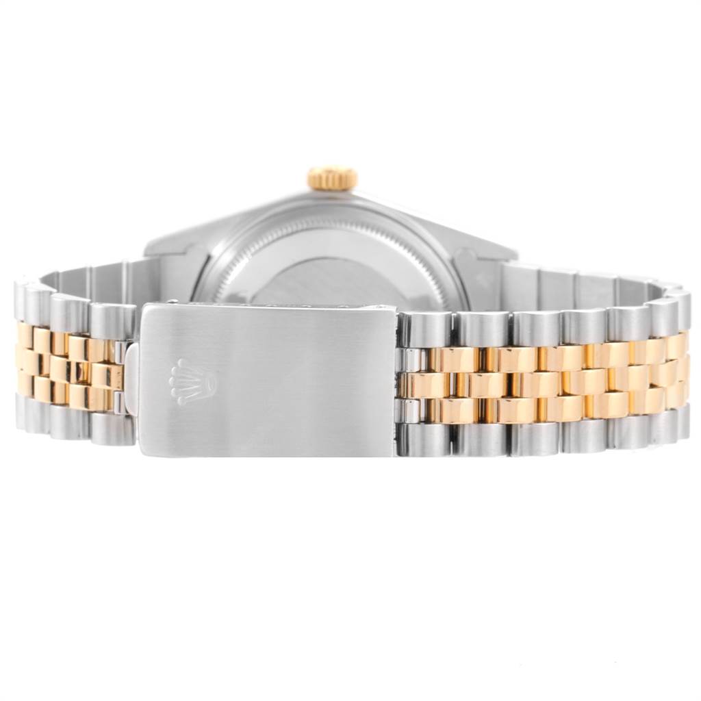 The image shows the rear view of a Rolex Vintage Collection 16013 Men's Stainless Steel Champagne Dial 16013 Men's Stainless Steel Champagne Dial watch, focusing on its two-tone bracelet and clasp.