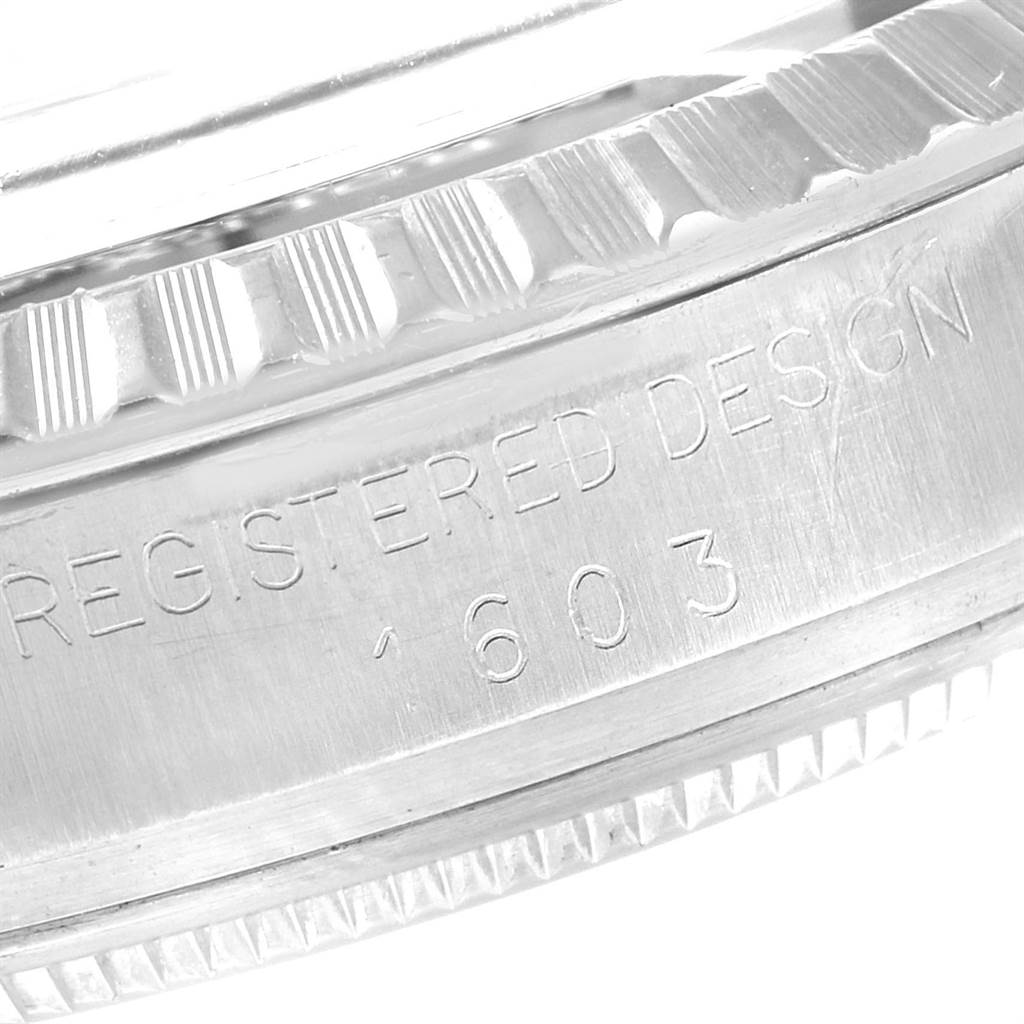 This image shows a close-up of the side engraving and bezel of a Rolex Vintage Collection 1603 Men's Stainless Steel Green Dial 1603 Men's Stainless Steel Green Dial model 1603 watch.